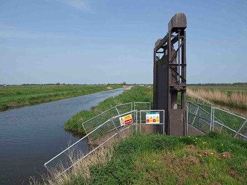 Picture of canal with flood control system.